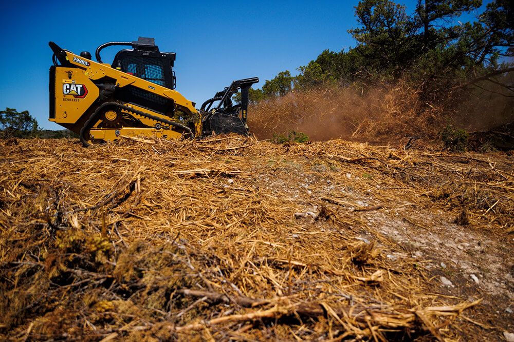 Bobcat finishing up mulching brush.