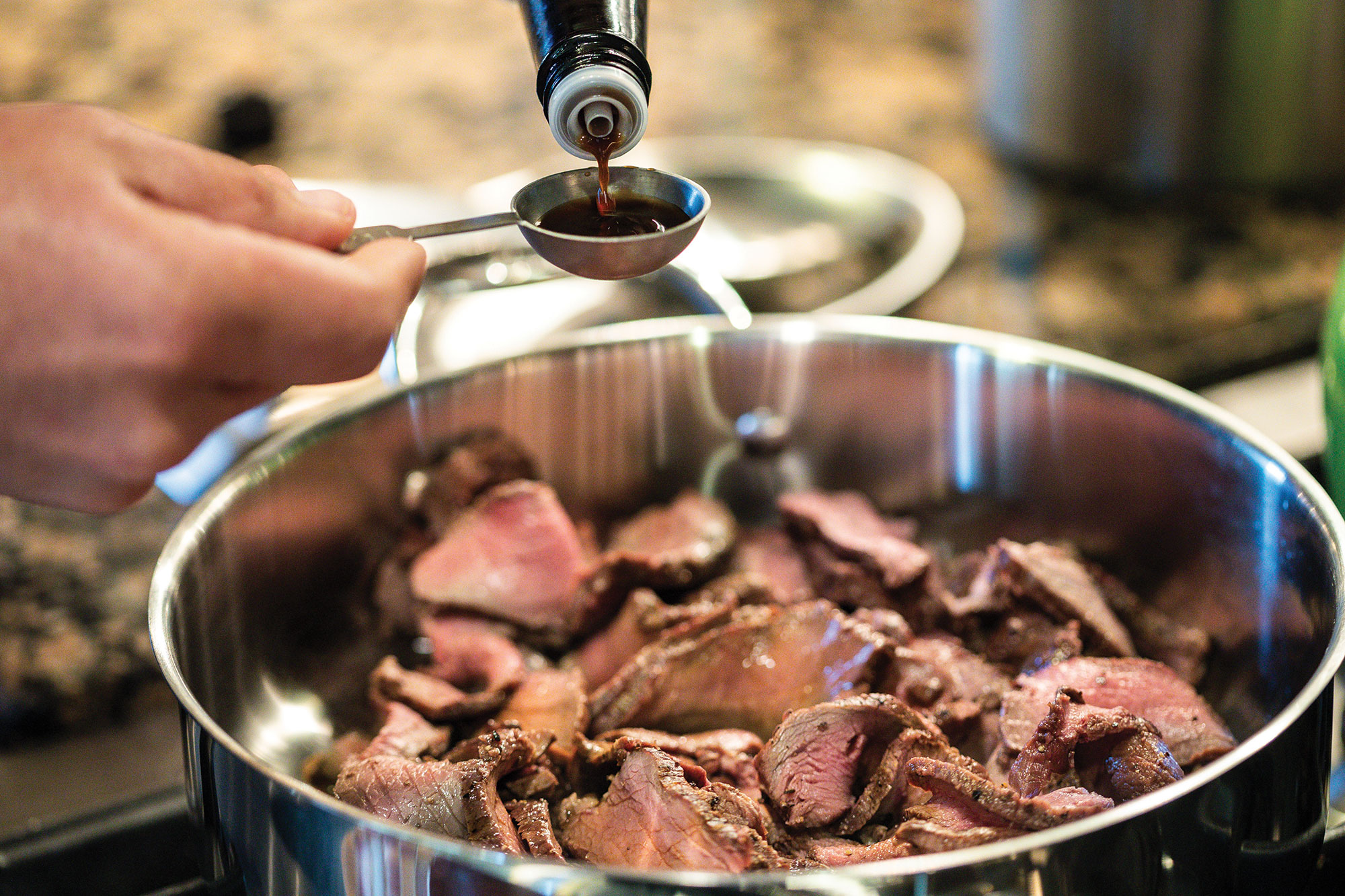 Adding Worcestershire to pan of meat