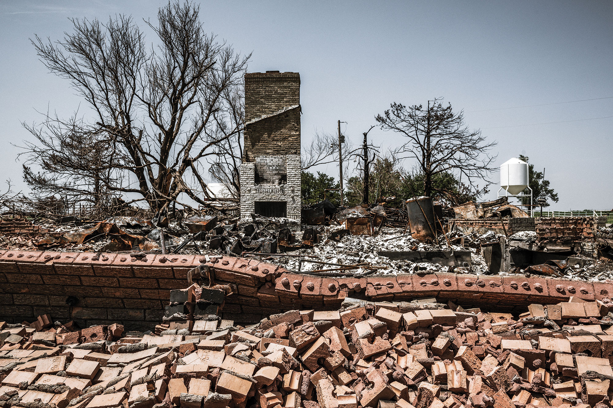 A house lies in pieces as a result of the Rhea Fire.