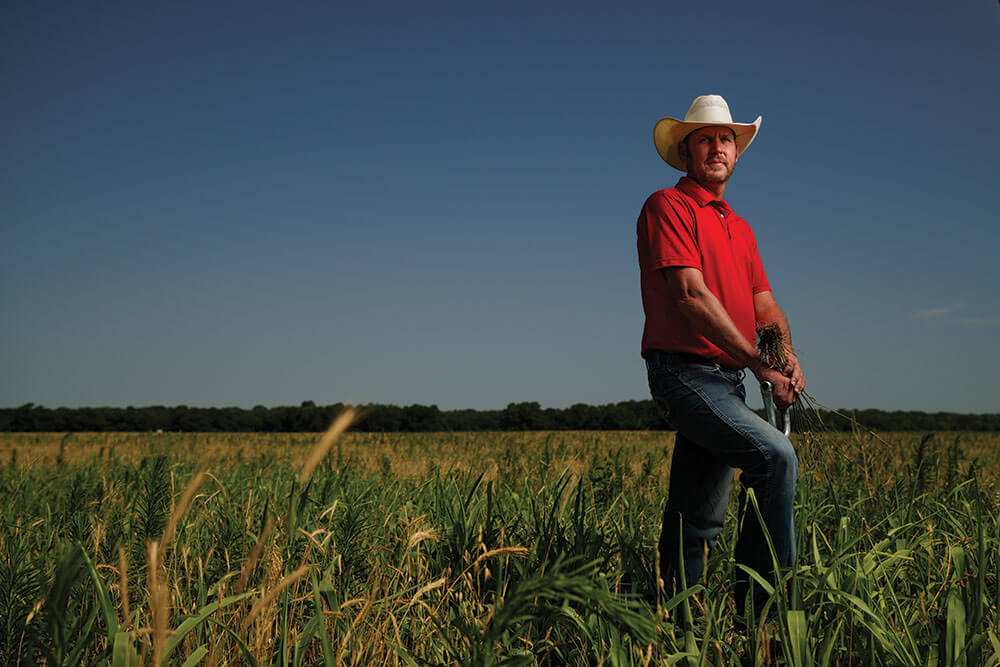 Kevin Pierce holding plant roots