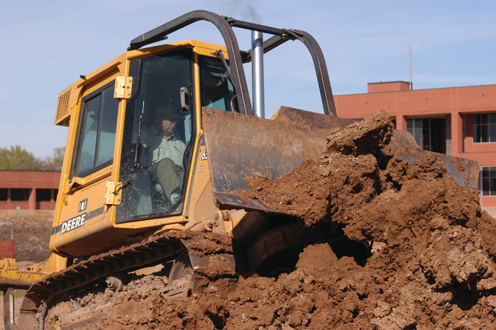 Mike Cawley drives a bulldozer