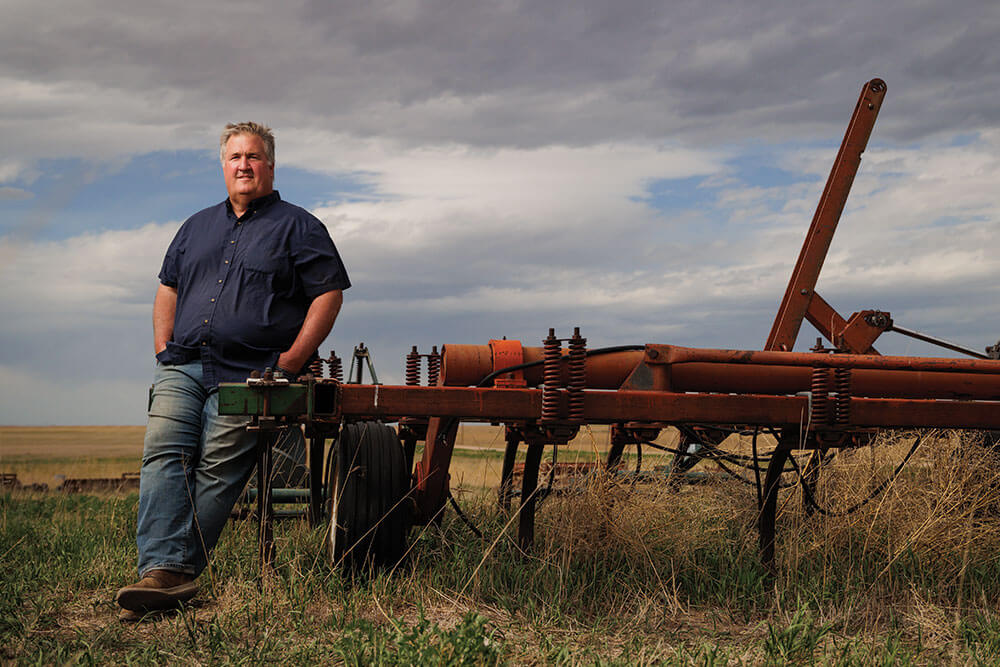 Steve Tucker with old tillage equipment