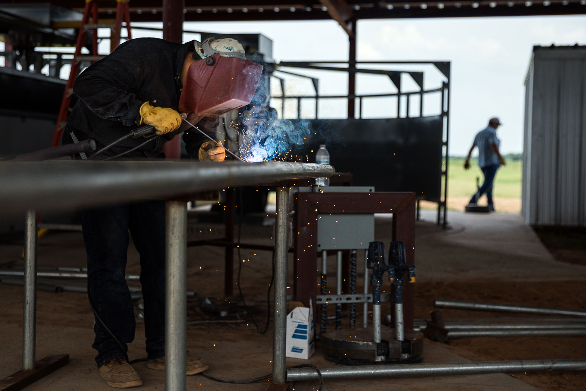 Welder assembling fencing