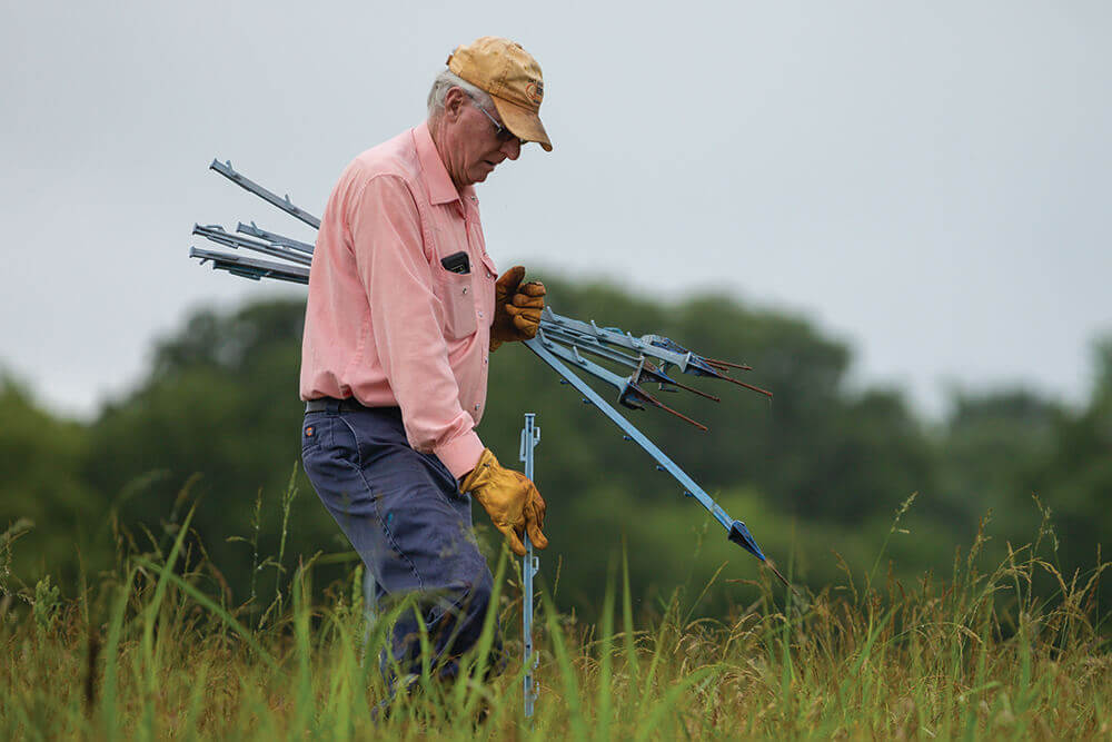 William Payne working on his land